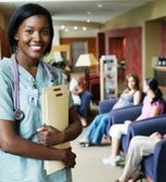 a nurse holding files in waiting room